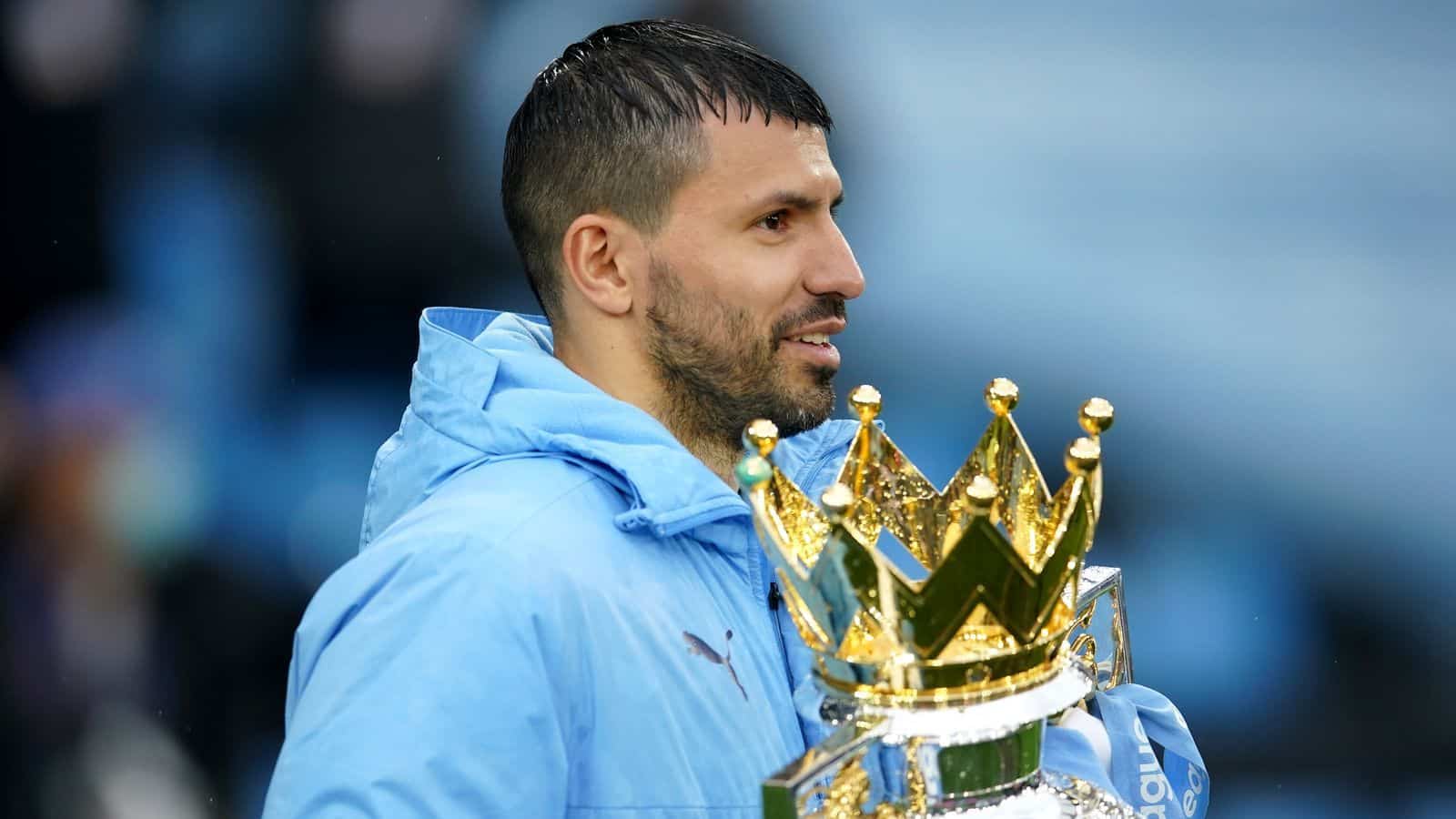 Sergio Aguero pictured holding the Premier League trophy
