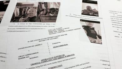 The affidavit to support the arrest of Arian Taherzadeh and Haider Ali is photographed Wednesday, April 6, 2022. Federal prosecutors have charged the two men they say were posing as federal agents, giving free apartments and other gifts to U.S. Secret Service agents, including one who worked on the first lady's security detail. Both were taken into custody as more than a dozen FBI agents charged into a luxury apartment building in Southeast Washington on Wednesday evening. (AP Photo/Jon Elswick)