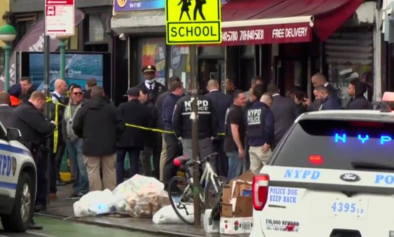 This still image provided by WABC shows law enforcement gathering at the scene of a shooting in the Brooklyn borough of New York on Tuesday, April 12, 2022. Law enforcement sources say five people were shot  at a subway station in Brooklyn . Fire personnel responding to reports of smoke Tuesday morning at the 36th Street station in Sunset Park found multiple people shot and unexploded devices. (WABC via AP)